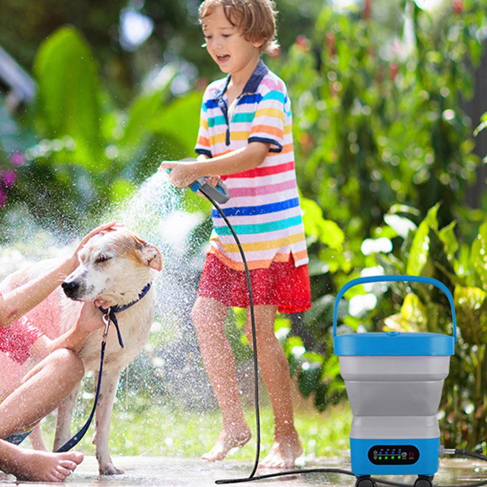 Child using a hose to spray water on a dog with a portable electric stove in the background